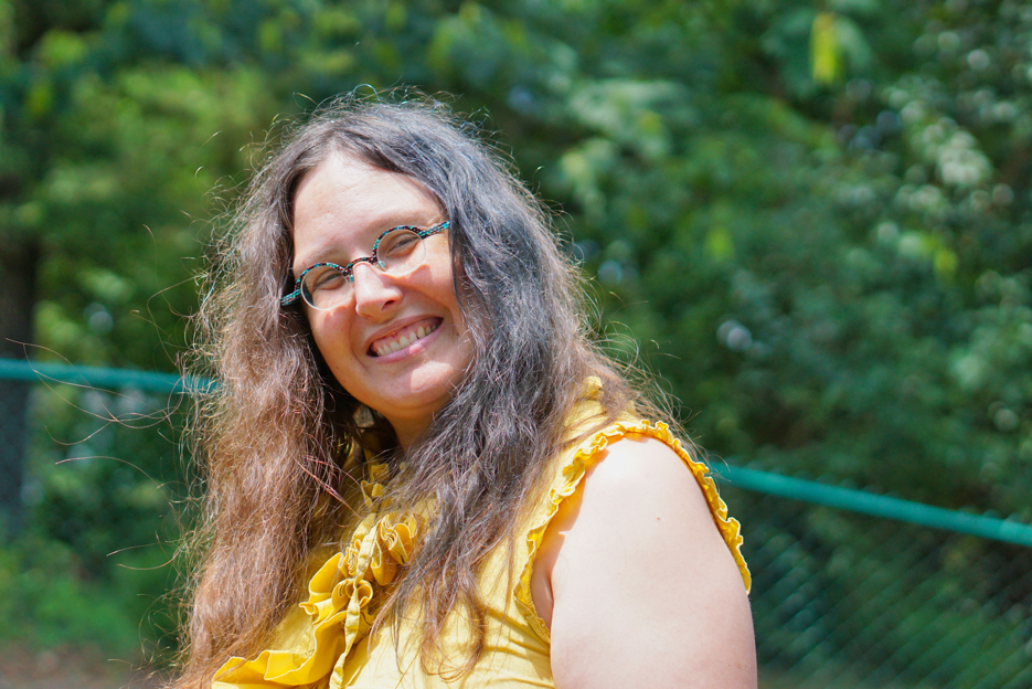 Veronica smiles at the camera and shows off her teal streak!