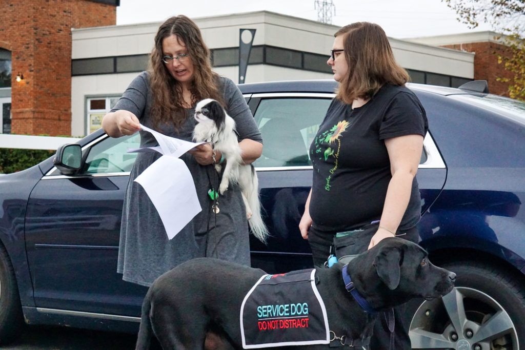 Veronica holds Hestia and goes over the results of the Manners Evaluation with Kristi.