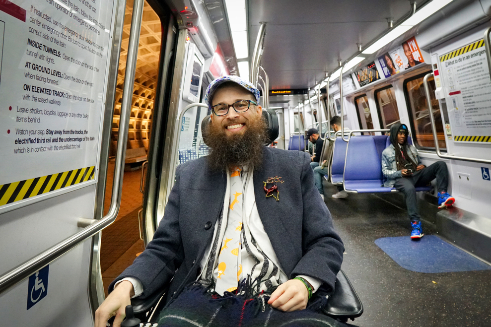 Brad smiles while on the Metro train.