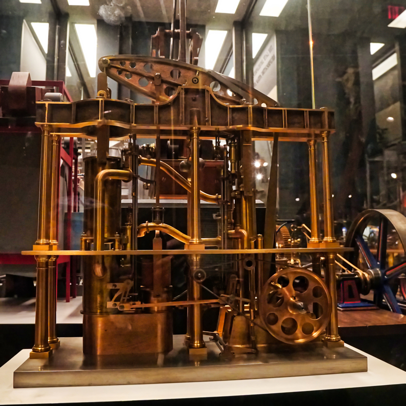 An ornate brass model steam engine.