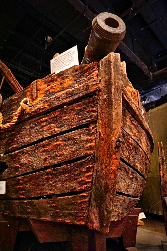 A very old wooden gunboat hull with a cannon on top. We wanted to see more, but didn't want to deal with getting an employee for the wheelchair lift this display required.